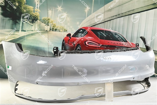 Rear bumper with ParkAssist and reversing camera holes, sports exhaust